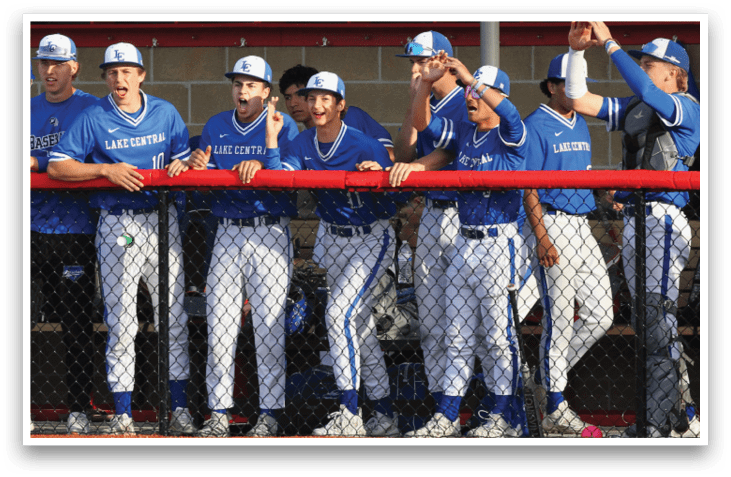 Baseball players wearing blue and white uniforms. Description generated by AI