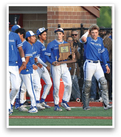 A group of baseball players wearing blue uniforms. Description generated by AI