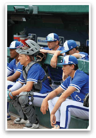 Baseball players sitting on bench. Description generated by AI