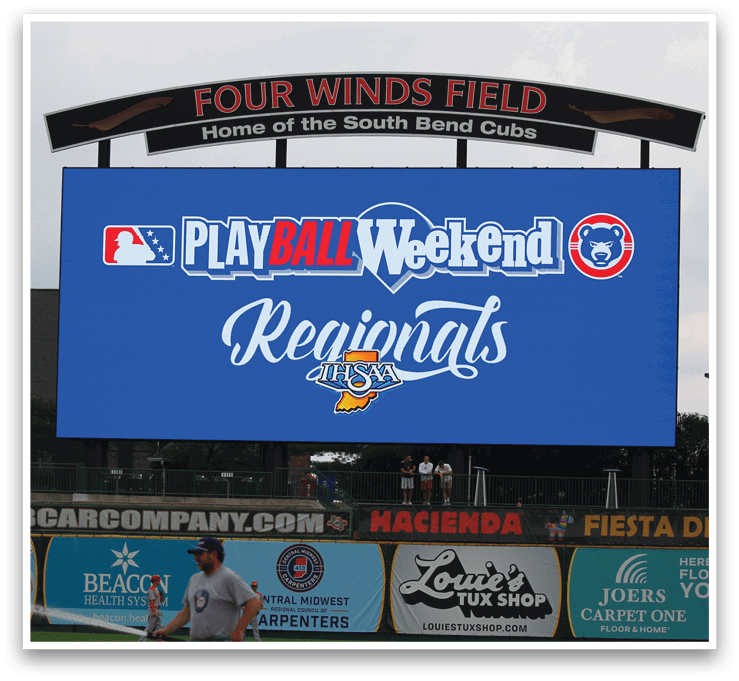 A large blue sign with white letters that says “Play Ball Weekend Regions". Description generated by AI