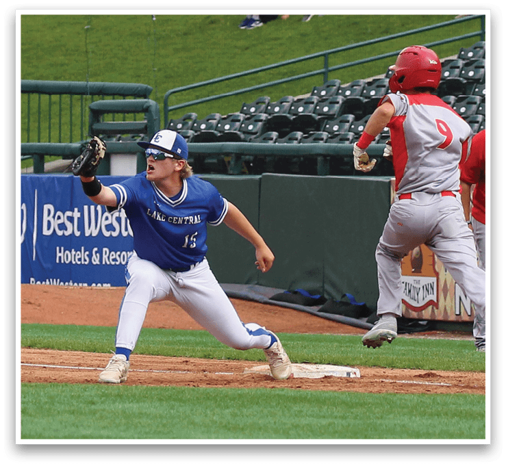 A baseball player sliding into home base. Description generated by AI