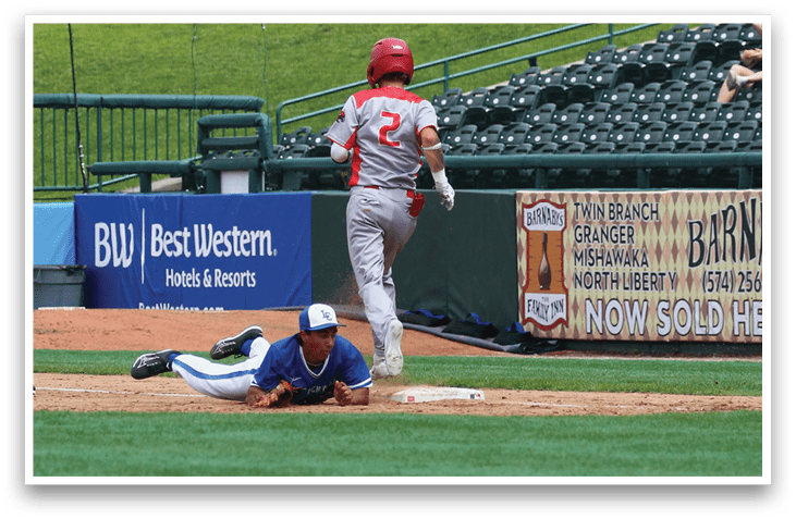 A baseball player sliding into a base. Description generated by AI