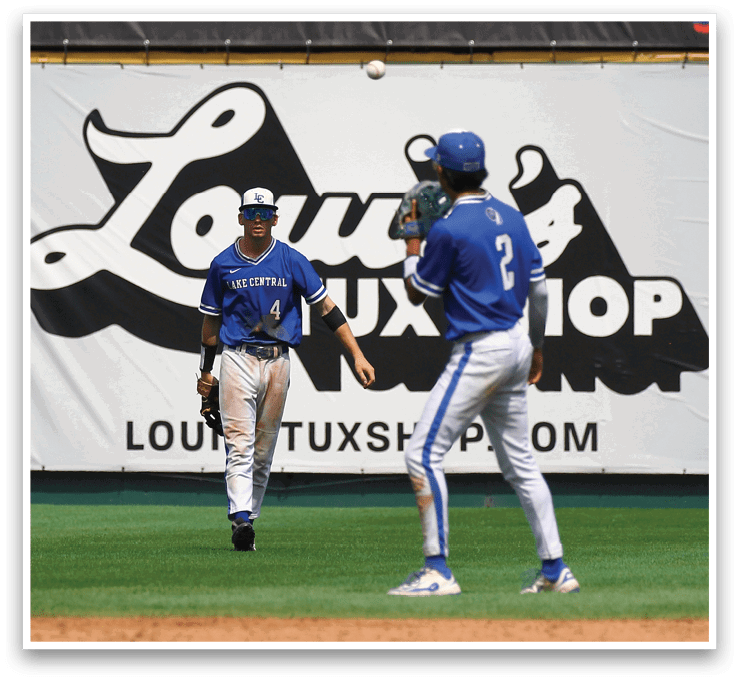 A baseball player wearing a blue shirt and blue pants. Description generated by AI