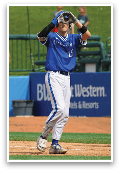 A baseball player wearing a blue shirt and white pants. Description generated by AI