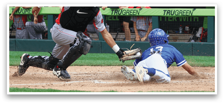 A baseball player sliding into a base. Description generated by AI