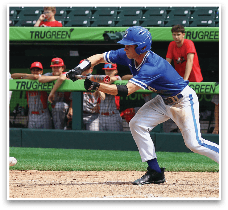 A baseball player in a blue and white uniform is swinging a bat. Description generated by AI