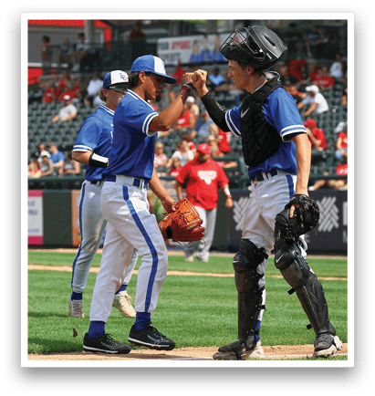 A baseball game with a group of men on the field. Description generated by AI