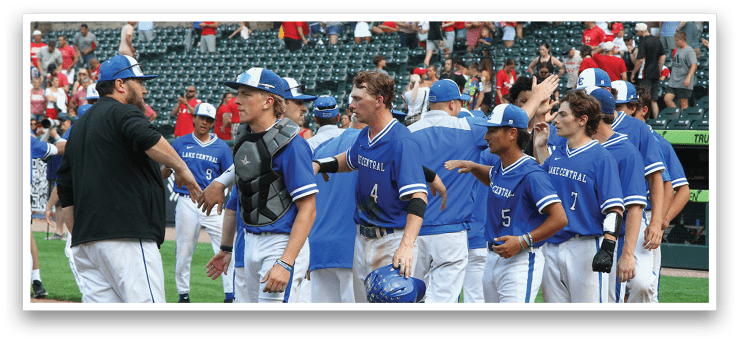 A group of baseball players wearing blue uniforms and blue hats. Description generated by AI