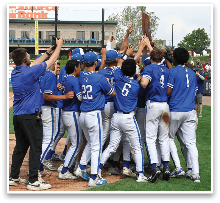 A group of baseball players celebrating on the field. Description generated by AI