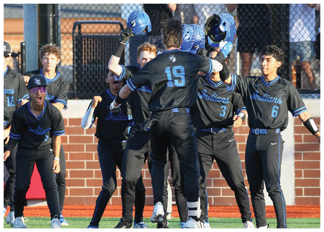 A group of baseball players celebrating a win. Description generated by AI