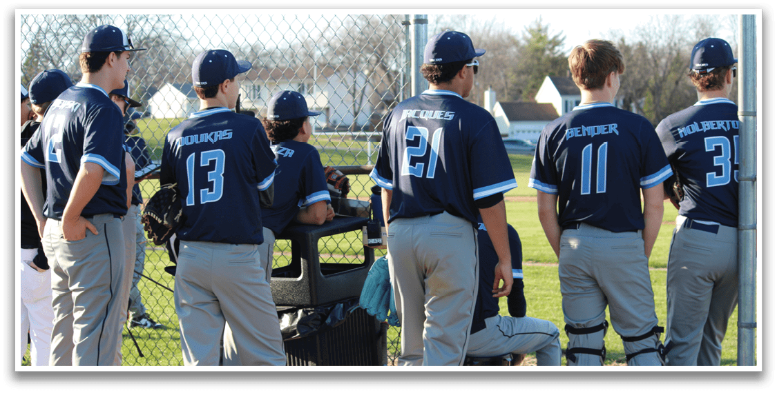 A group of baseball players wearing blue jerseys are standing on a field. AI generated content