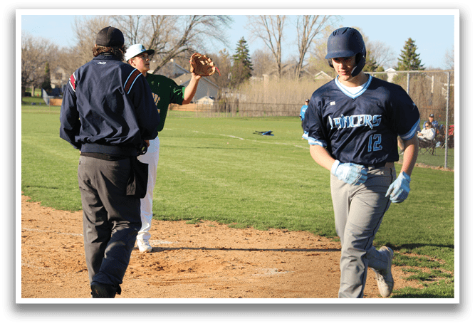 A baseball game is taking place with a man in a blue shirt and grey pants running towards home plate. Another man in a blue shirt and grey pants is standing nearby, possibly a coach or an umpire. The runner is holding a baseball glove, ready to catch the ball. AI generated content