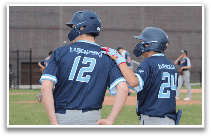 Two baseball players wearing blue uniforms and helmets are talking to each other on the field. AI generated content