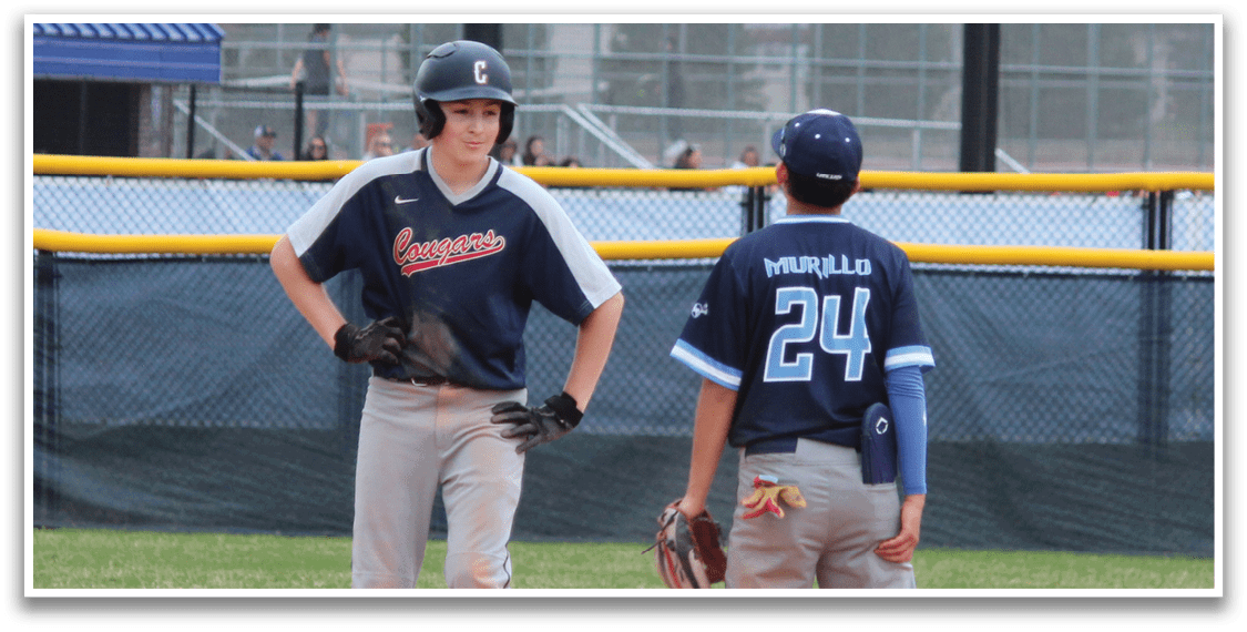 Two baseball players on a field, one wearing a blue shirt and the other wearing a blue and white shirt. AI generated content