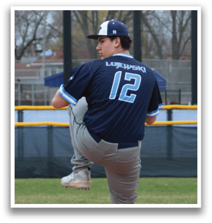 A baseball player in a blue shirt and grey pants is throwing a ball on a field. AI generated content