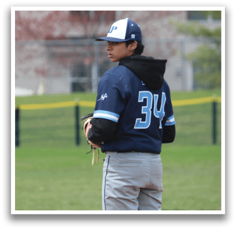 A baseball player wearing a blue and white jersey stands on a field. AI generated content