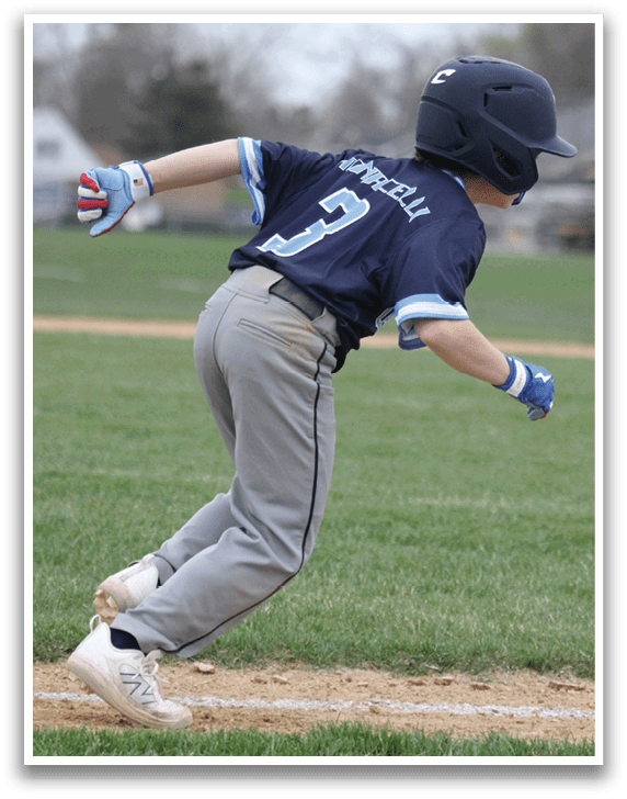 A boy in a blue baseball uniform is running on a field. AI generated content