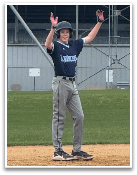 A baseball player is standing on the field with his arms raised. AI generated content