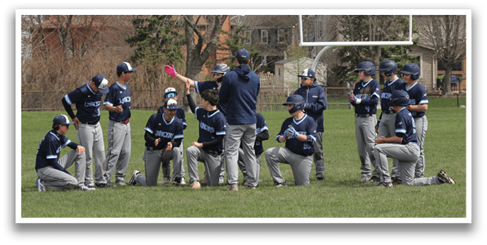 A group of baseball players are gathered on a field, some sitting and some standing. They are holding a pink object, possibly a pink frisbee. AI generated content