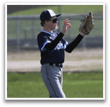 A boy in a baseball uniform is catching a ball with his glove. AI generated content