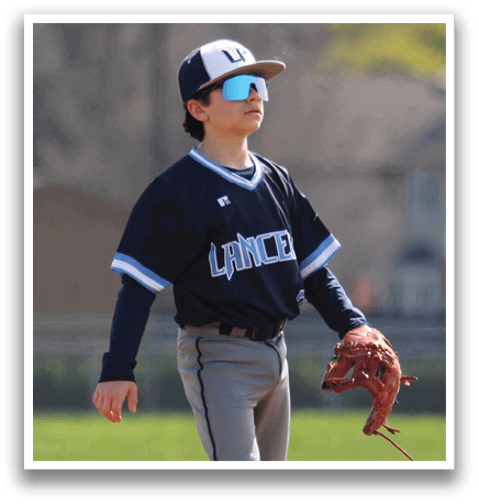 A young boy wearing a baseball uniform stands on a field, holding a baseball glove. AI generated content