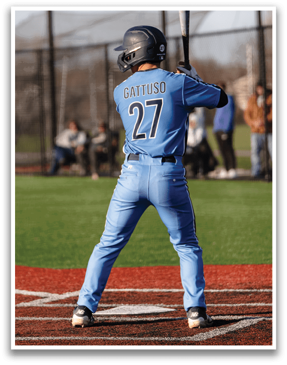 A baseball player in a blue uniform is holding a bat, preparing to swing at a pitch. AI generated content