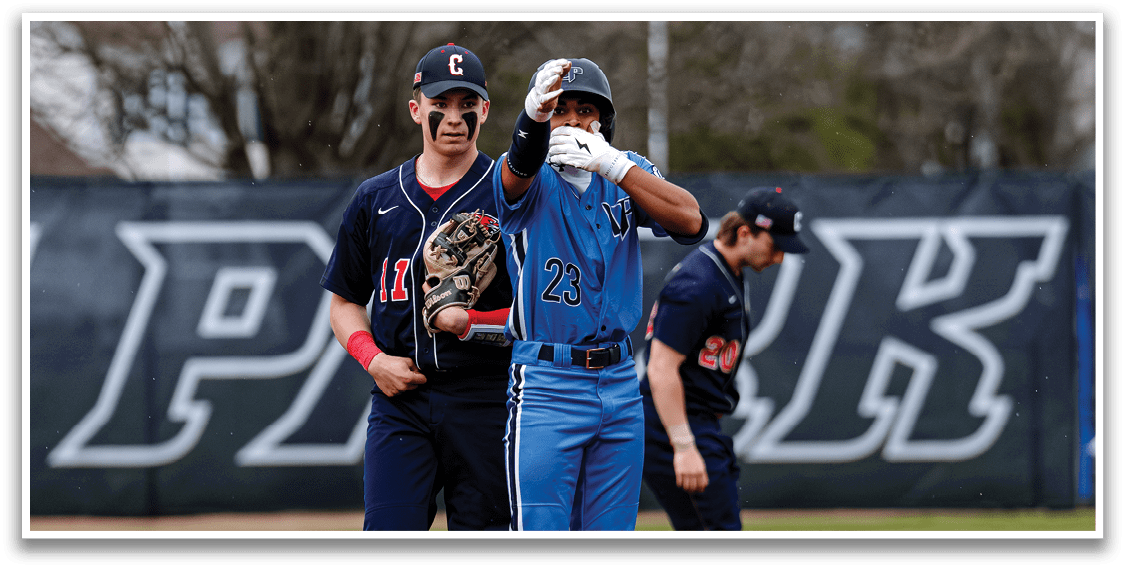 A baseball player wearing a blue uniform is standing on the field, holding his glove up to his face. AI generated content