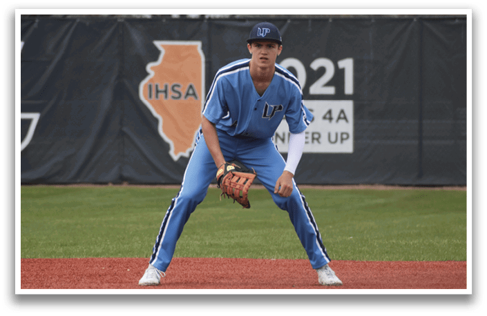 A baseball player in a blue uniform stands on the field, holding a mitt. AI generated content