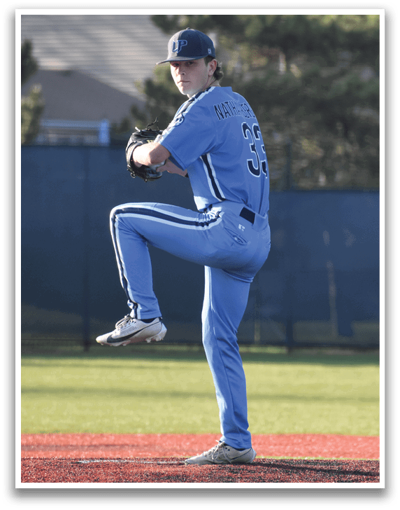 A baseball player in a blue uniform is on the mound, getting ready to throw the ball. AI generated content
