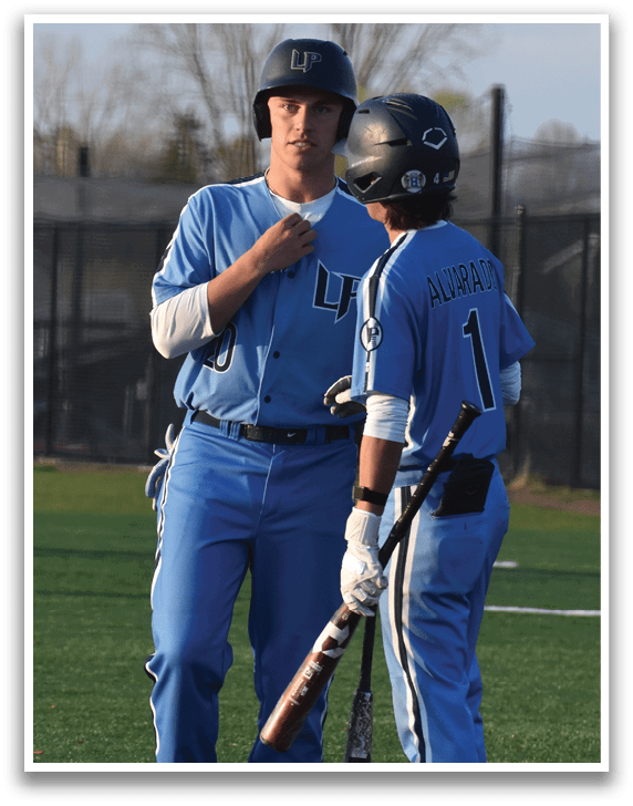 Two baseball players wearing blue uniforms are talking to each other on the field. AI generated content