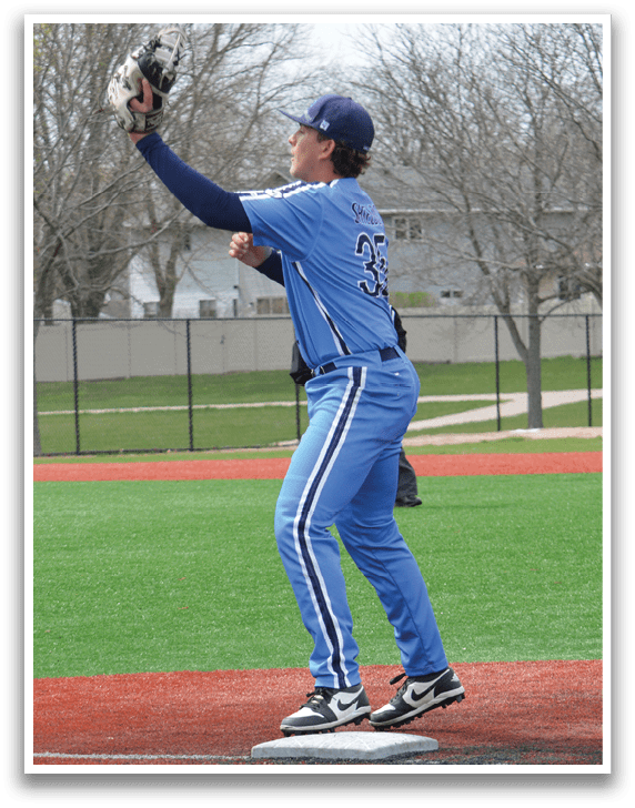 A baseball player in a blue uniform is jumping in the air to catch a ball. AI generated content