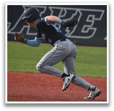 A baseball player in a blue shirt and grey pants is running on the field. AI generated content