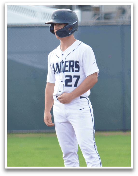 A baseball player wearing a helmet and a jersey with the number 12 stands on a base. AI generated content