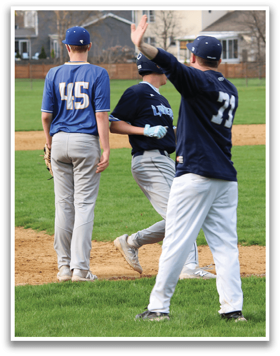 A baseball game is taking place on a field with several players. One player is pointing towards the sky, possibly indicating a ball or signaling a play. The players are wearing baseball gloves and are spread out across the field. AI generated content