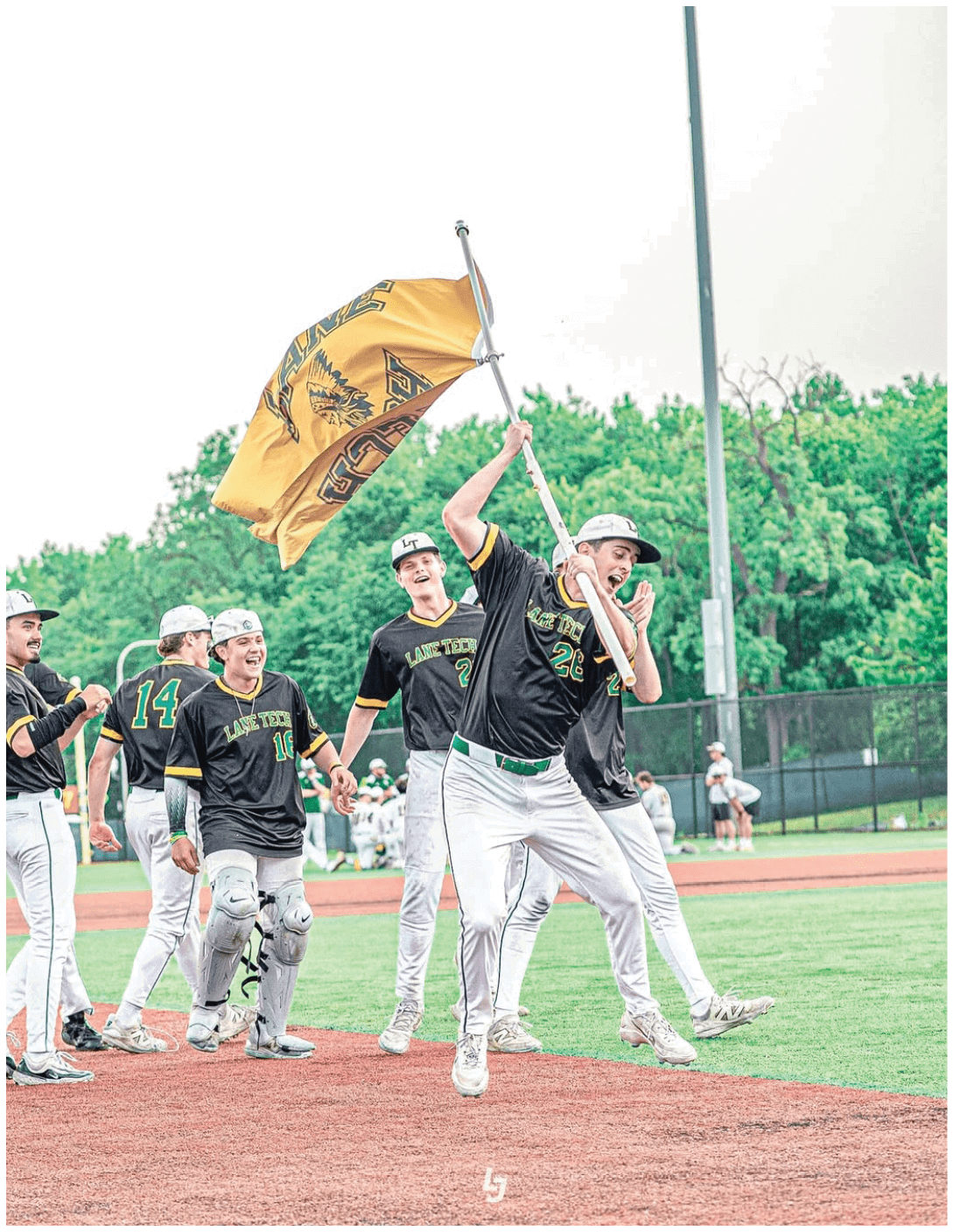 A baseball player celebrating with his teammates. Description generated by AI