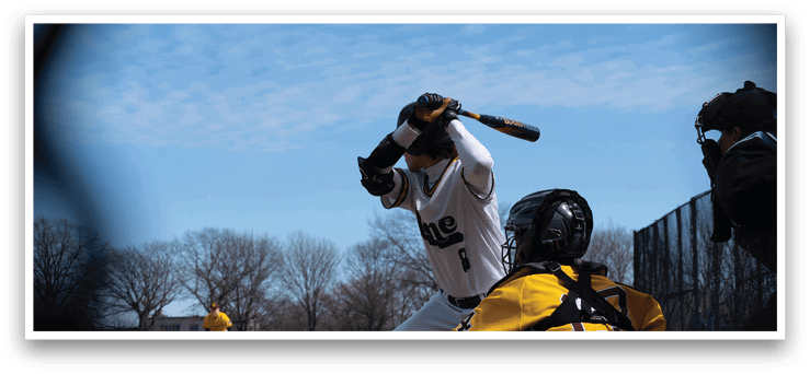 A baseball player is swinging a bat, attempting to hit a ball. The catcher is positioned behind him, wearing a baseball glove. AI generated content
