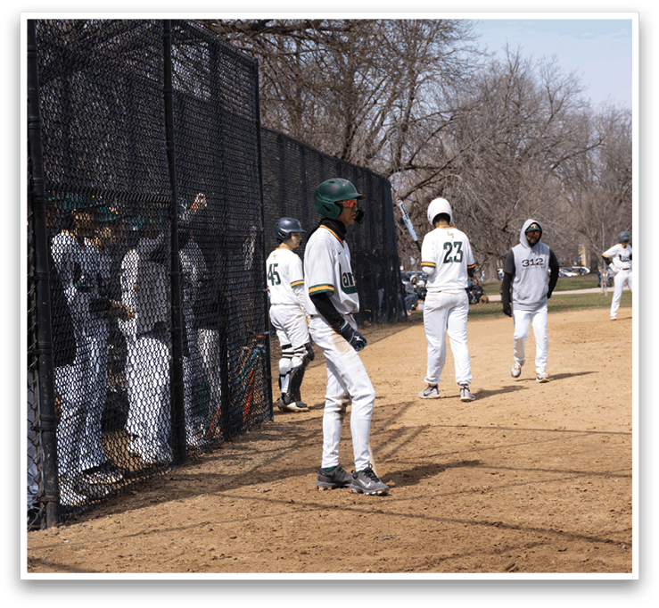 Baseball players are standing on a field, some of them wearing green and white uniforms. They are watching a game, with one player holding a baseball bat. AI generated content