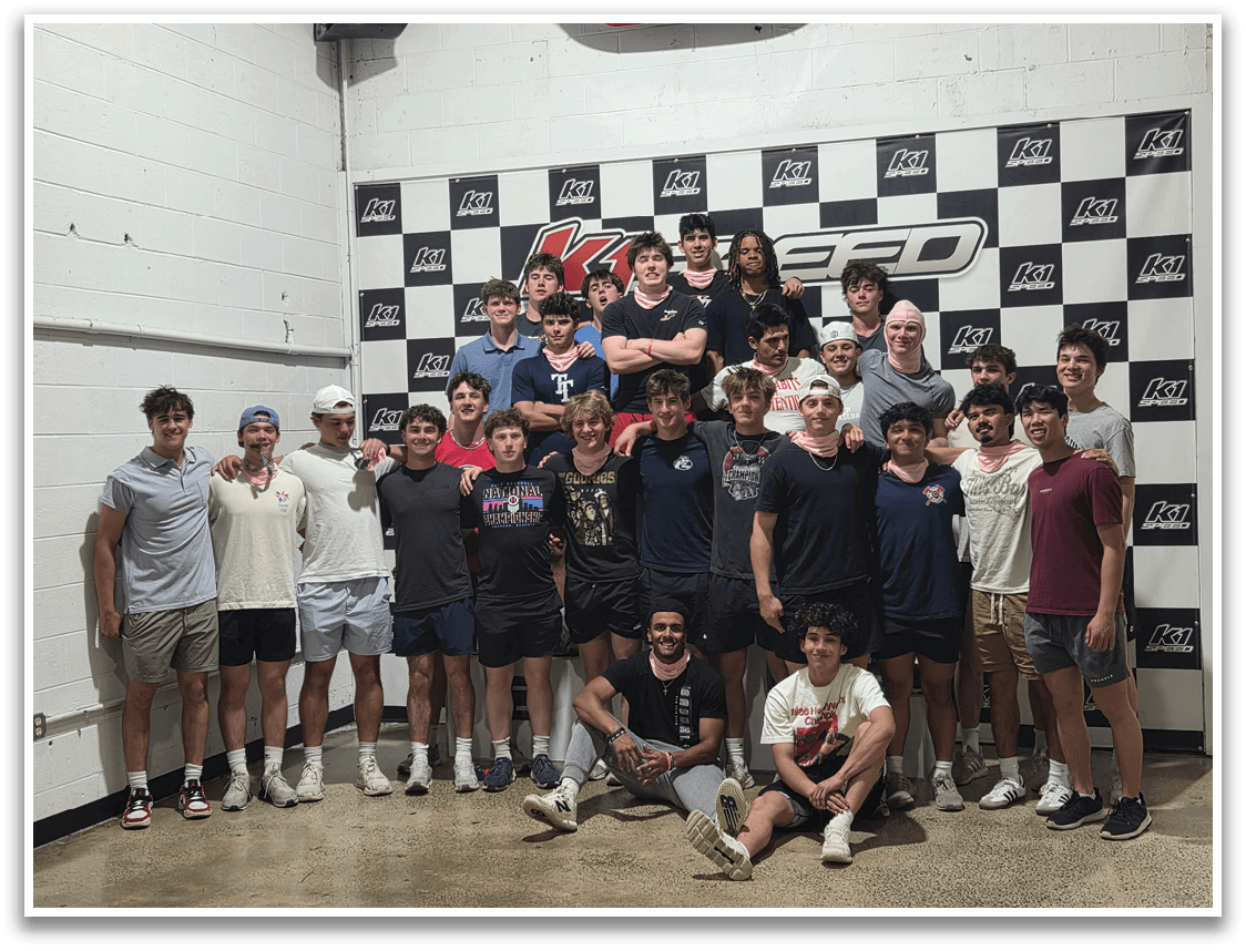 A group of young men pose for a photo in front of a checkered wall. AI generated content