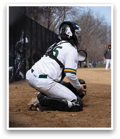 A baseball catcher is squatting behind home plate, wearing a white uniform and a helmet. AI generated content