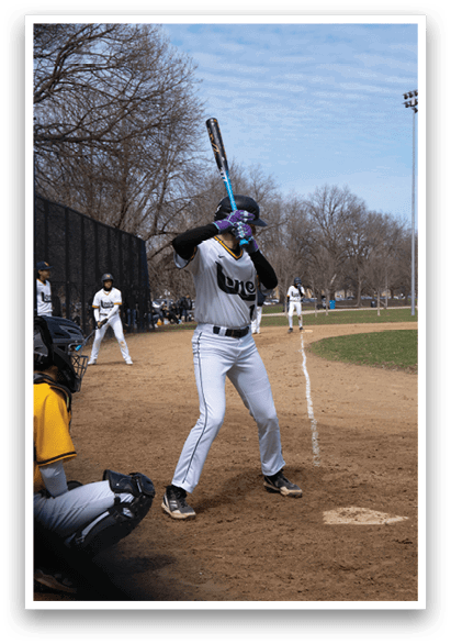 A baseball player is at bat, holding a bat and preparing to swing. AI generated content