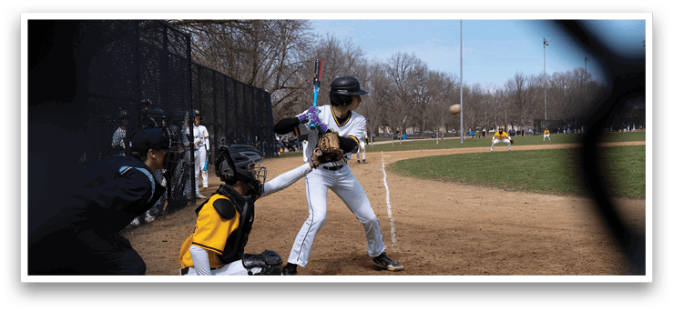 A baseball player is swinging a bat at a ball during a game. AI generated content