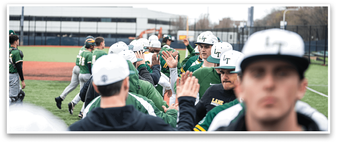A group of baseball players wearing green and white uniforms are hugging each other on a field. AI generated content