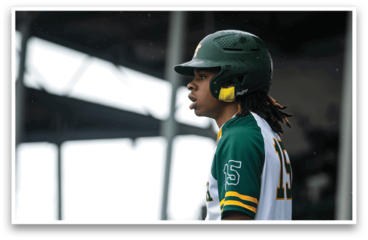 A baseball player wearing a green and white uniform stands on a field. AI generated content