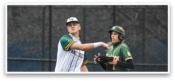 Two baseball players on a field, one wearing a green shirt and the other wearing a white shirt. They are shaking hands and congratulating each other. AI generated content
