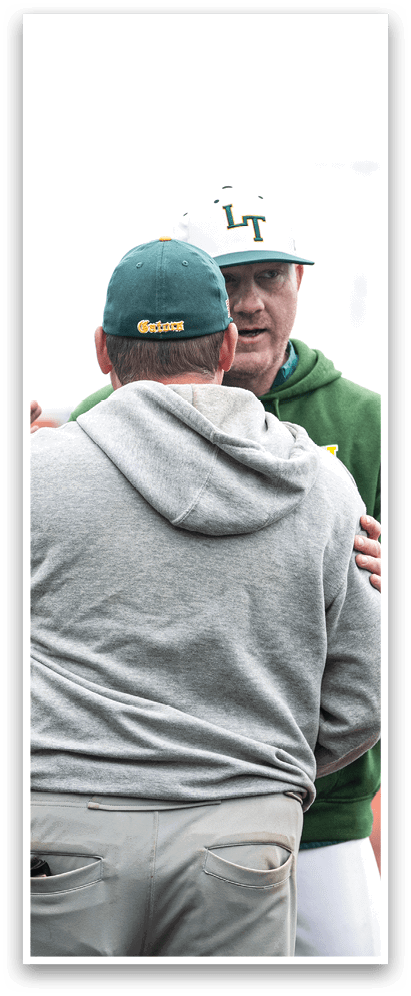 A baseball player in a white uniform is on the pitcher's mound, getting ready to throw the ball. AI generated content