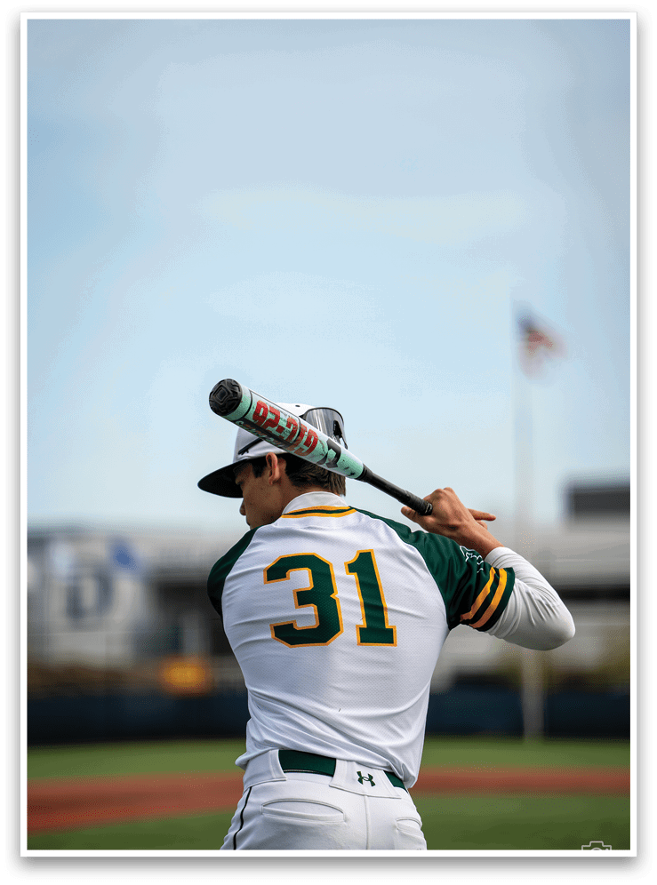 A baseball player in a white uniform is holding a bat, preparing to swing. AI generated content