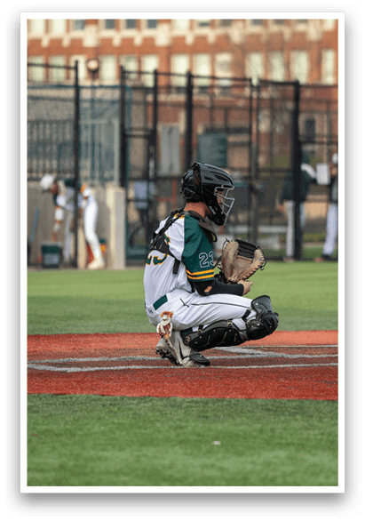 A baseball player is squatting on the field, wearing a catcher's mitt. AI generated content