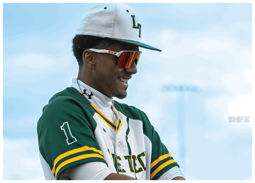 A man wearing a green and white baseball uniform. Description generated by AI