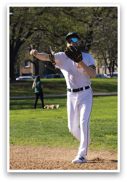 A man in a white uniform is playing baseball. Description generated by AI