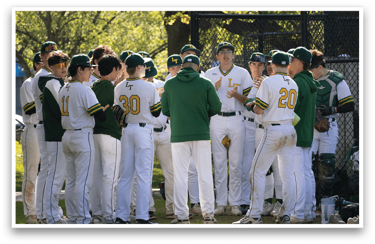 A group of baseball players wearing green and white uniforms. Description generated by AI